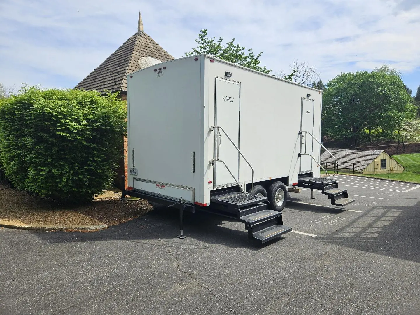 APT restroom trailer set up with entry stairs at a Central Virginia venue